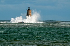 Waves Break Around Whaleback Lighthouse Tower in Maine